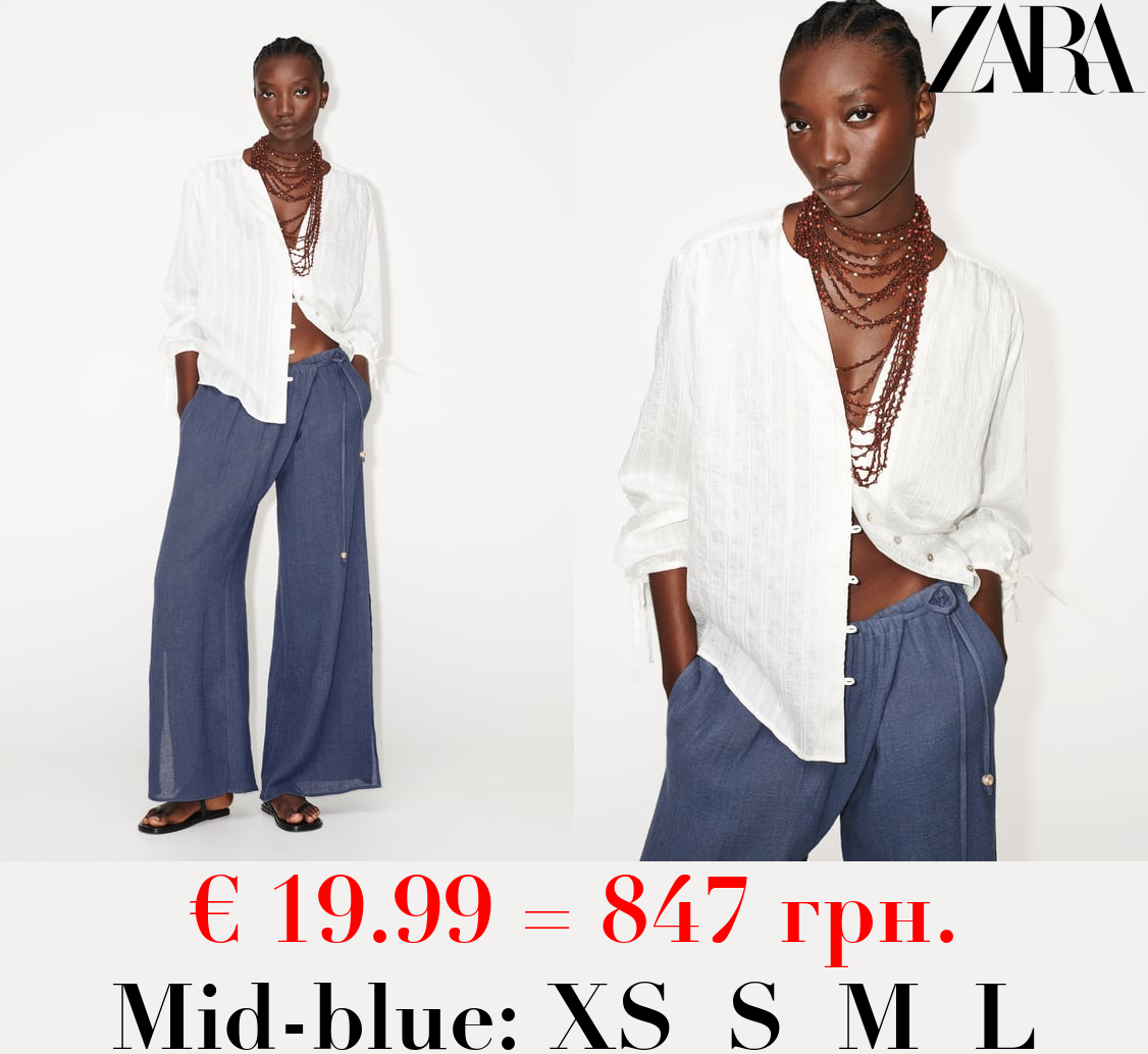 WIDE-LEG WRAP TROUSERS WITH SIDE OPENINGS