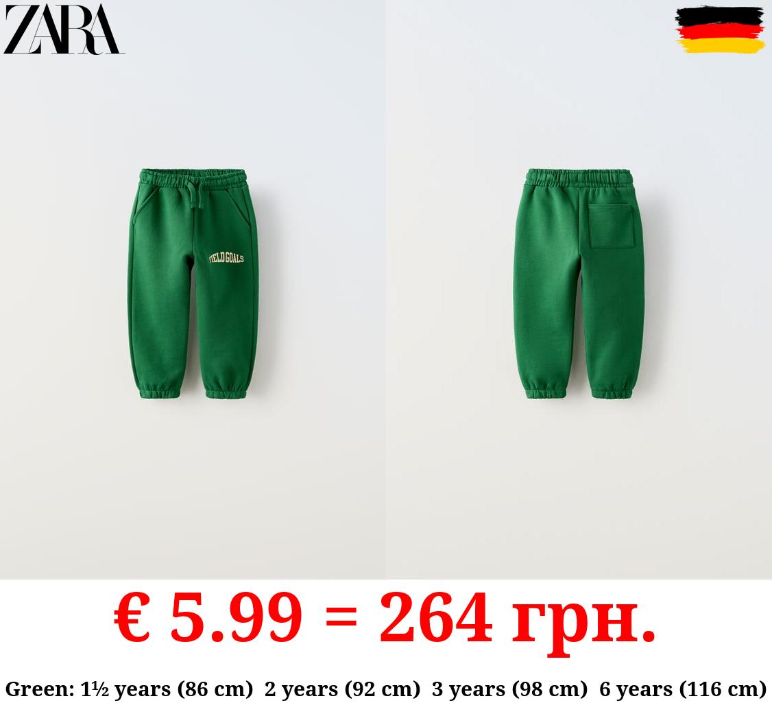 PLUSH TROUSERS WITH RAISED SLOGAN