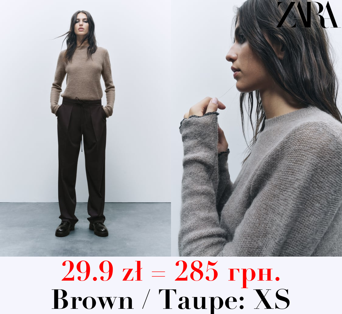 KNIT SWEATER WITH ROLLING TRIMS