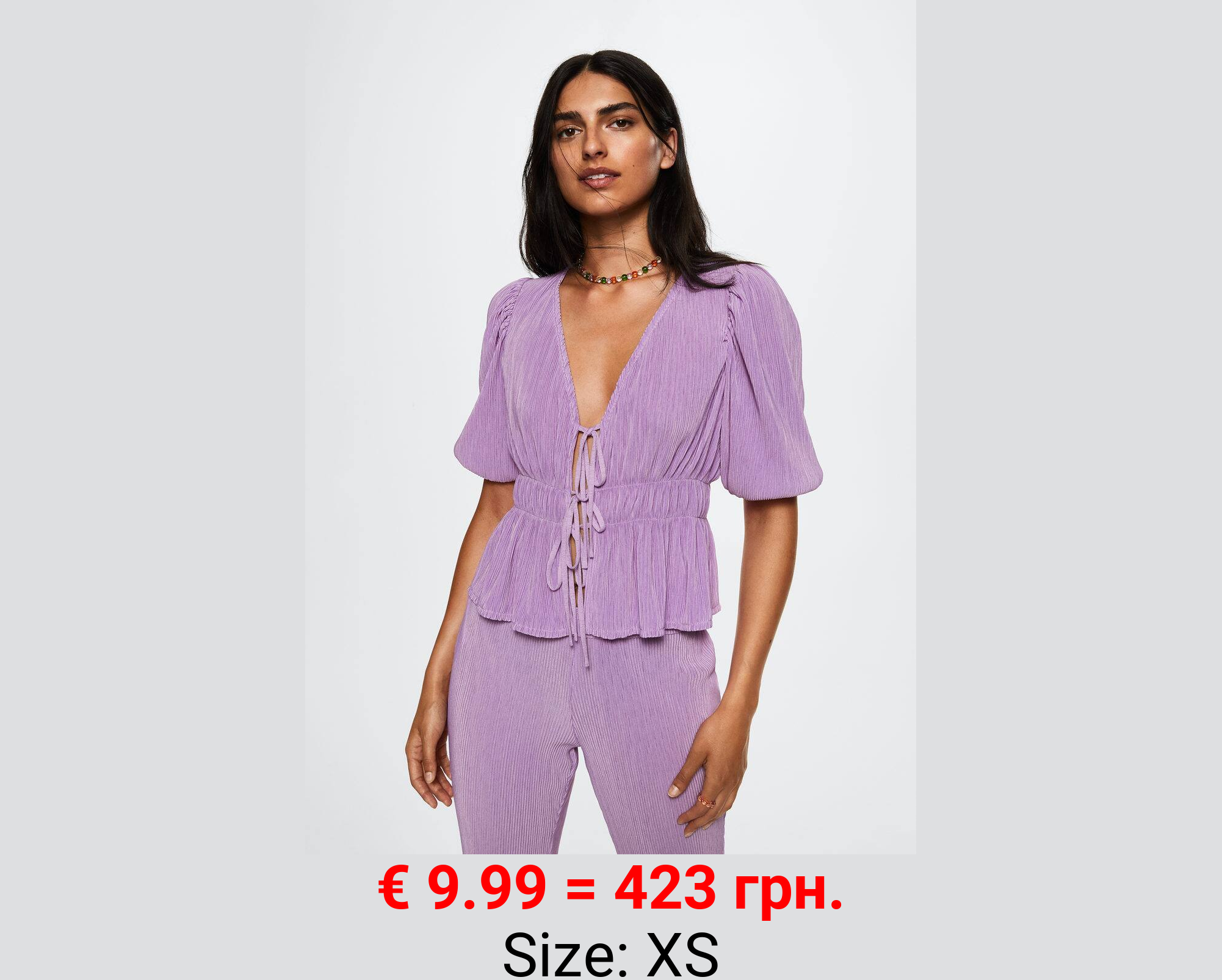 Blusa plisada volantes