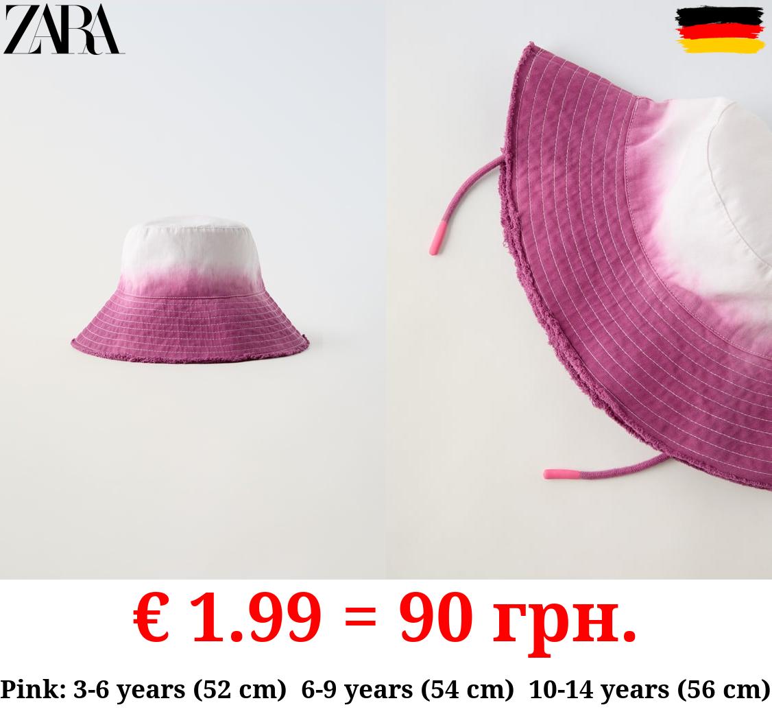 FRAYED TIE-DYE BUCKET HAT