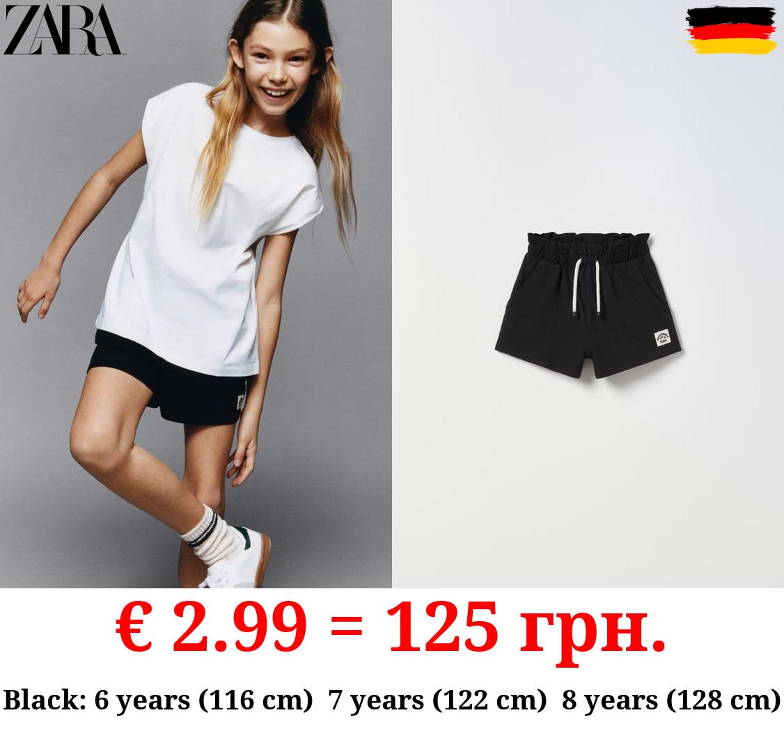 PLUSH BERMUDA SHORTS WITH LABEL DETAIL