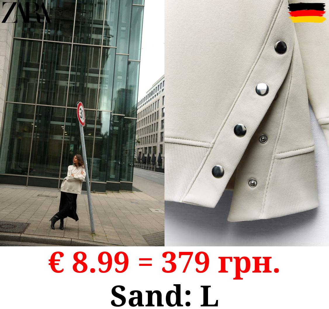 OVERSIZE SWEATSHIRT WITH SNAP BUTTONS