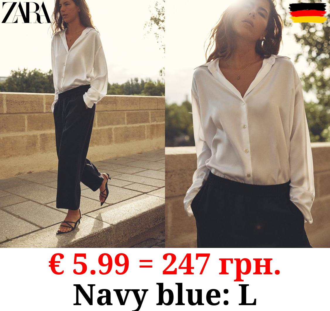 CARROT FIT TROUSERS WITH TABS AT HEM