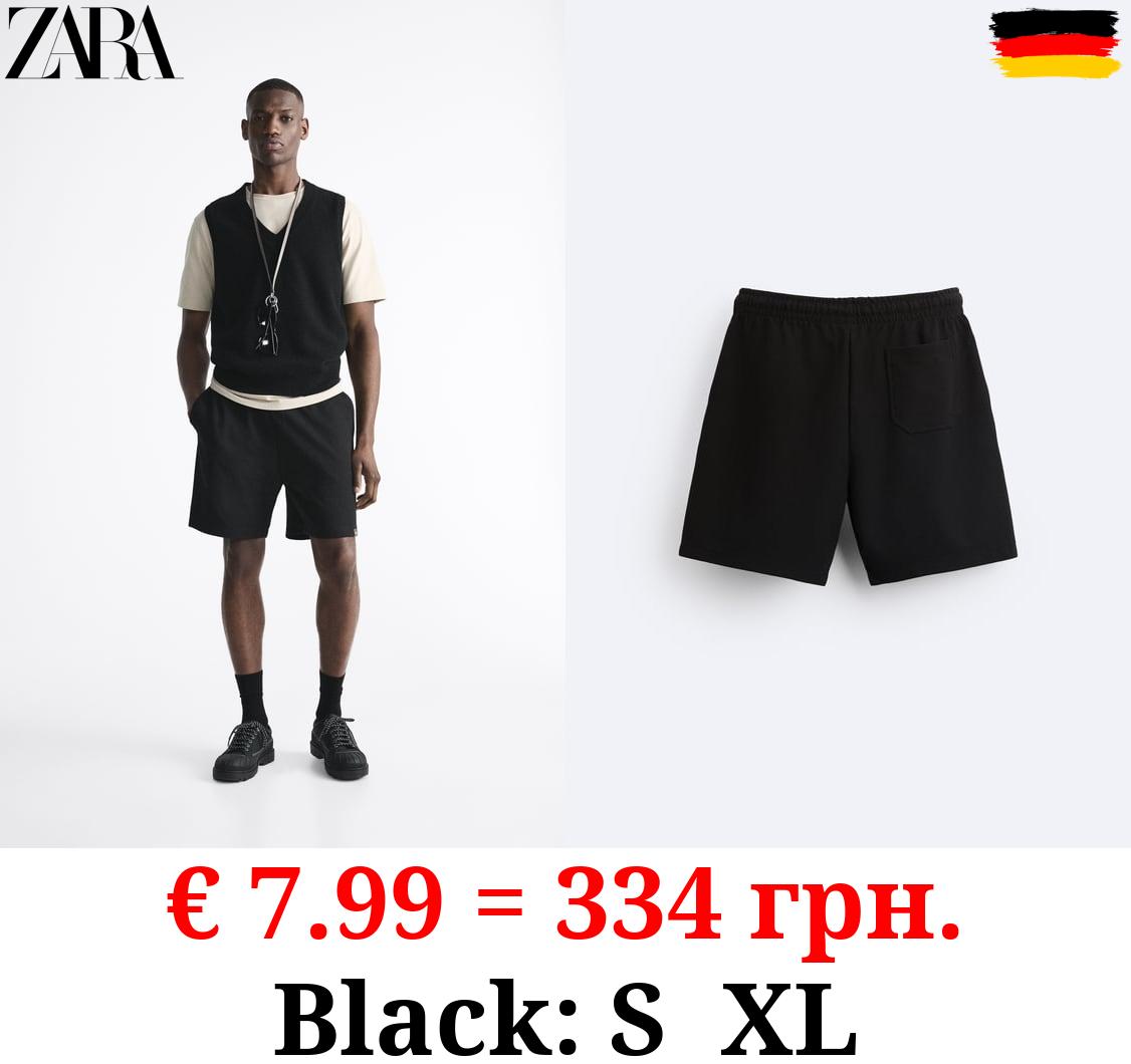 TEXTURED BERMUDA SHORTS WITH LABEL