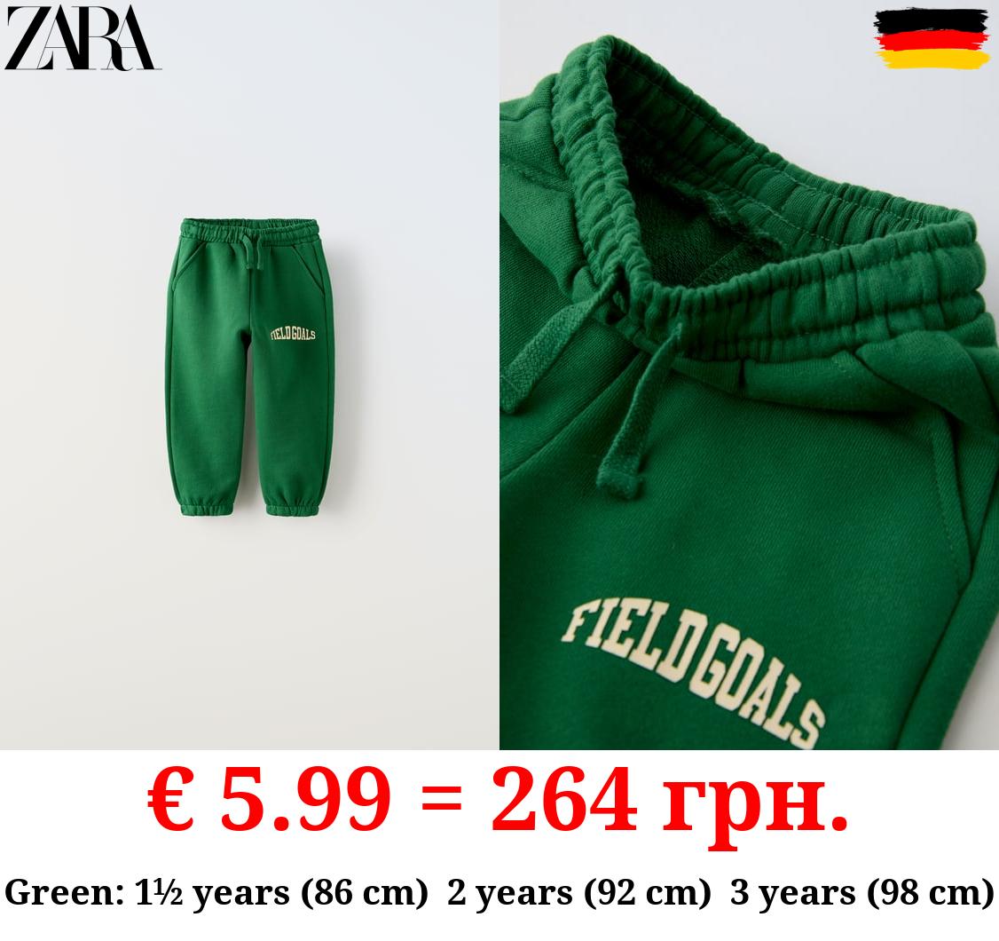 PLUSH TROUSERS WITH RAISED SLOGAN