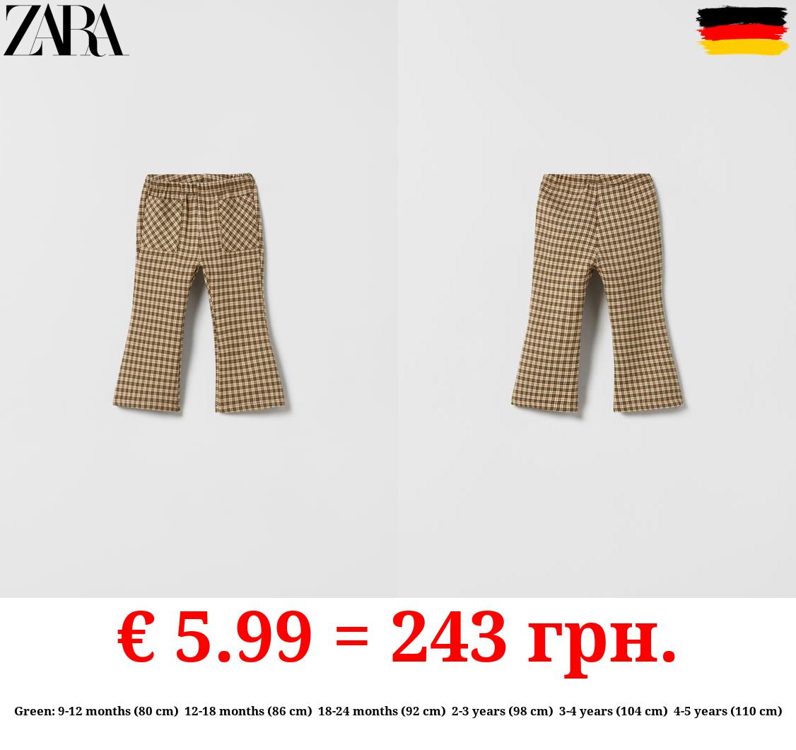 CHECKED FLARED TROUSERS