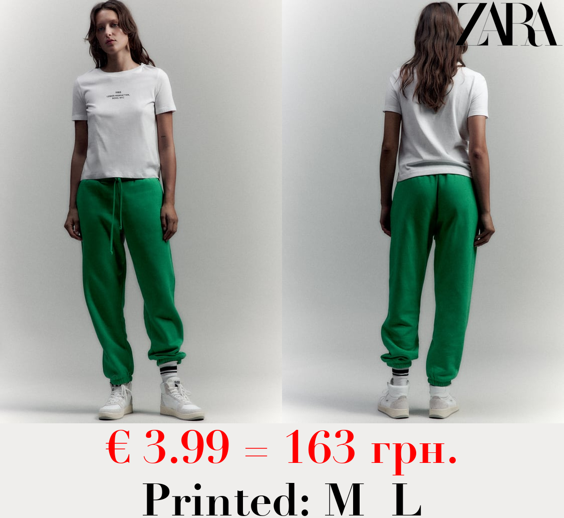 T-SHIRT WITH CONTRASTING SLOGAN