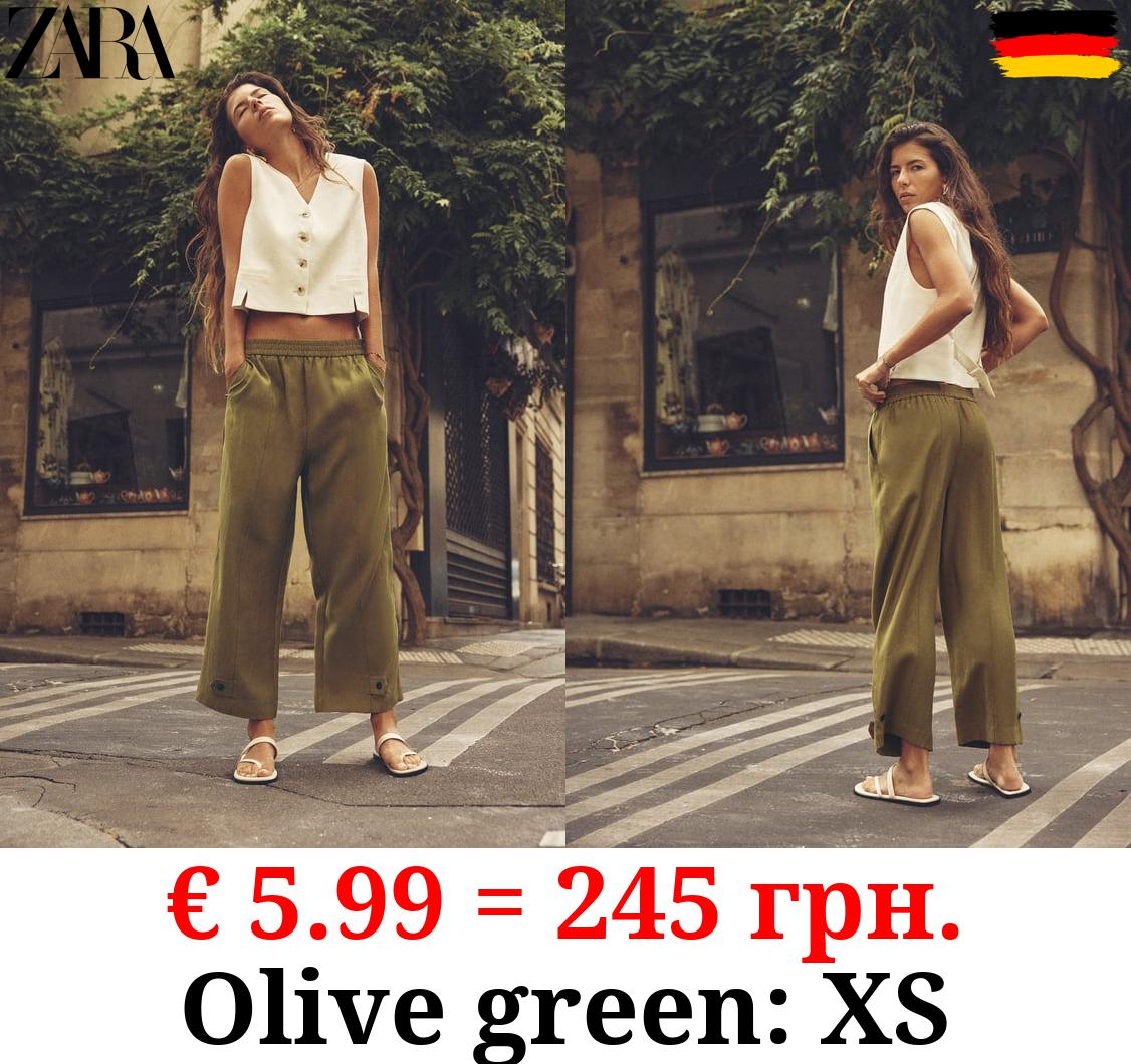 CARROT FIT TROUSERS WITH TABS AT HEM