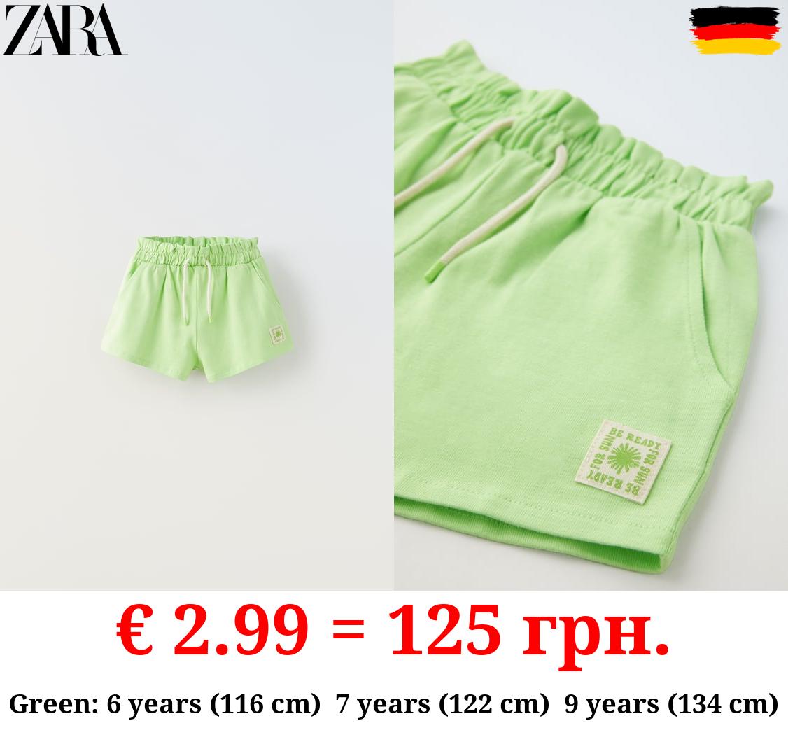 PLUSH BERMUDA SHORTS WITH LABEL DETAIL