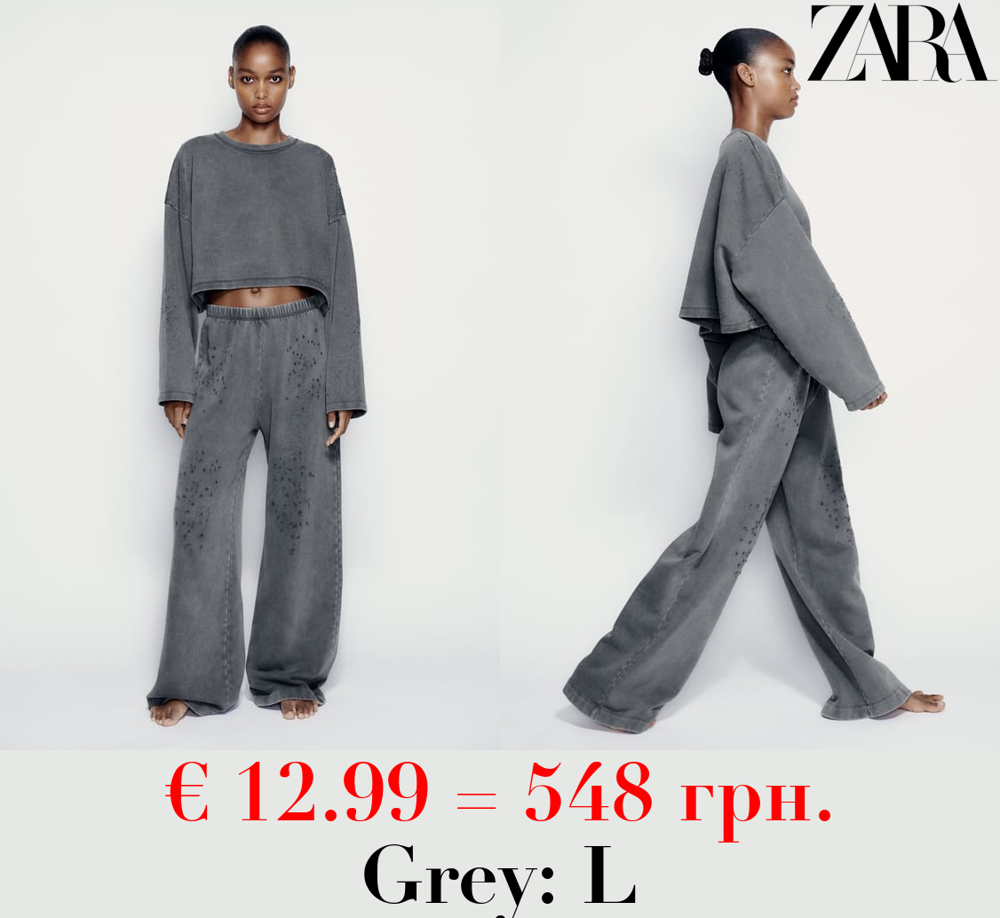 FADED-EFFECT RIPPED PLUSH TROUSERS