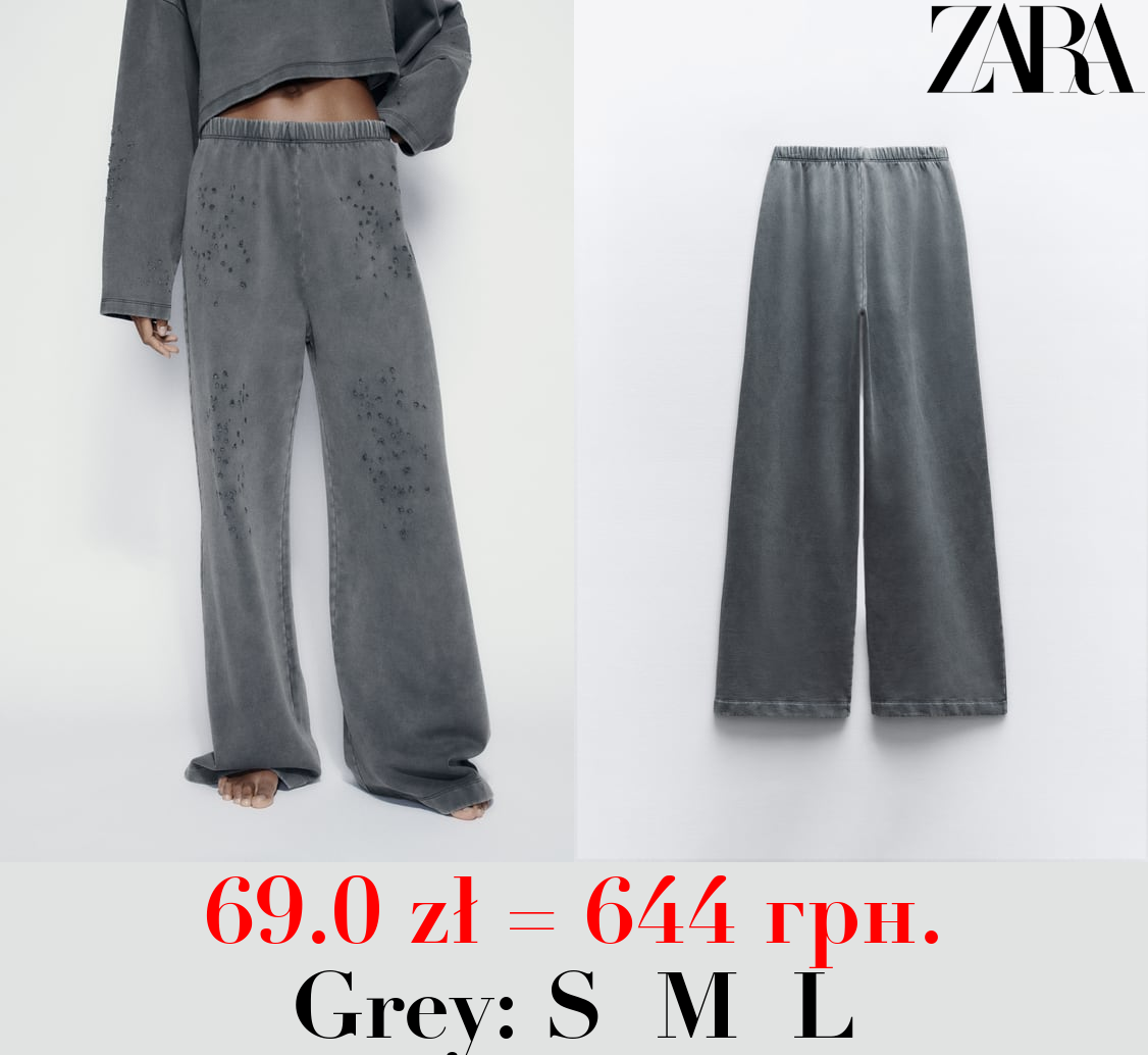 FADED-EFFECT RIPPED PLUSH TROUSERS