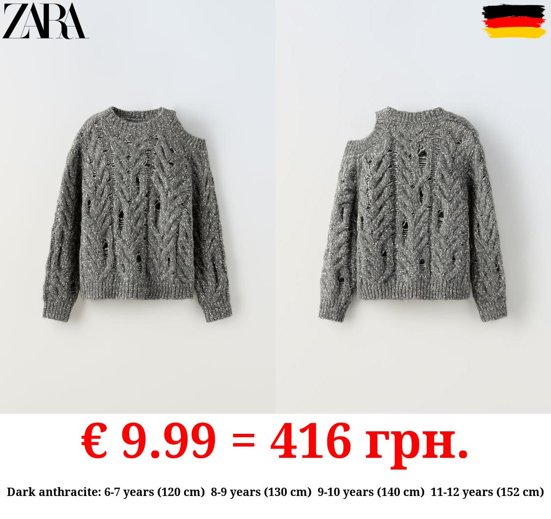 CUT-OUT CABLE-KNIT SWEATER