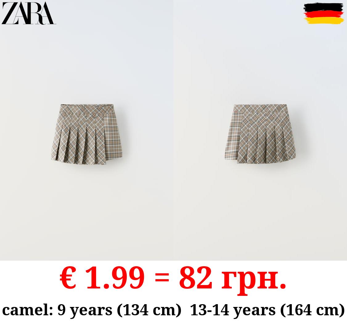 ASYMMETRIC BOX PLEAT SKIRT