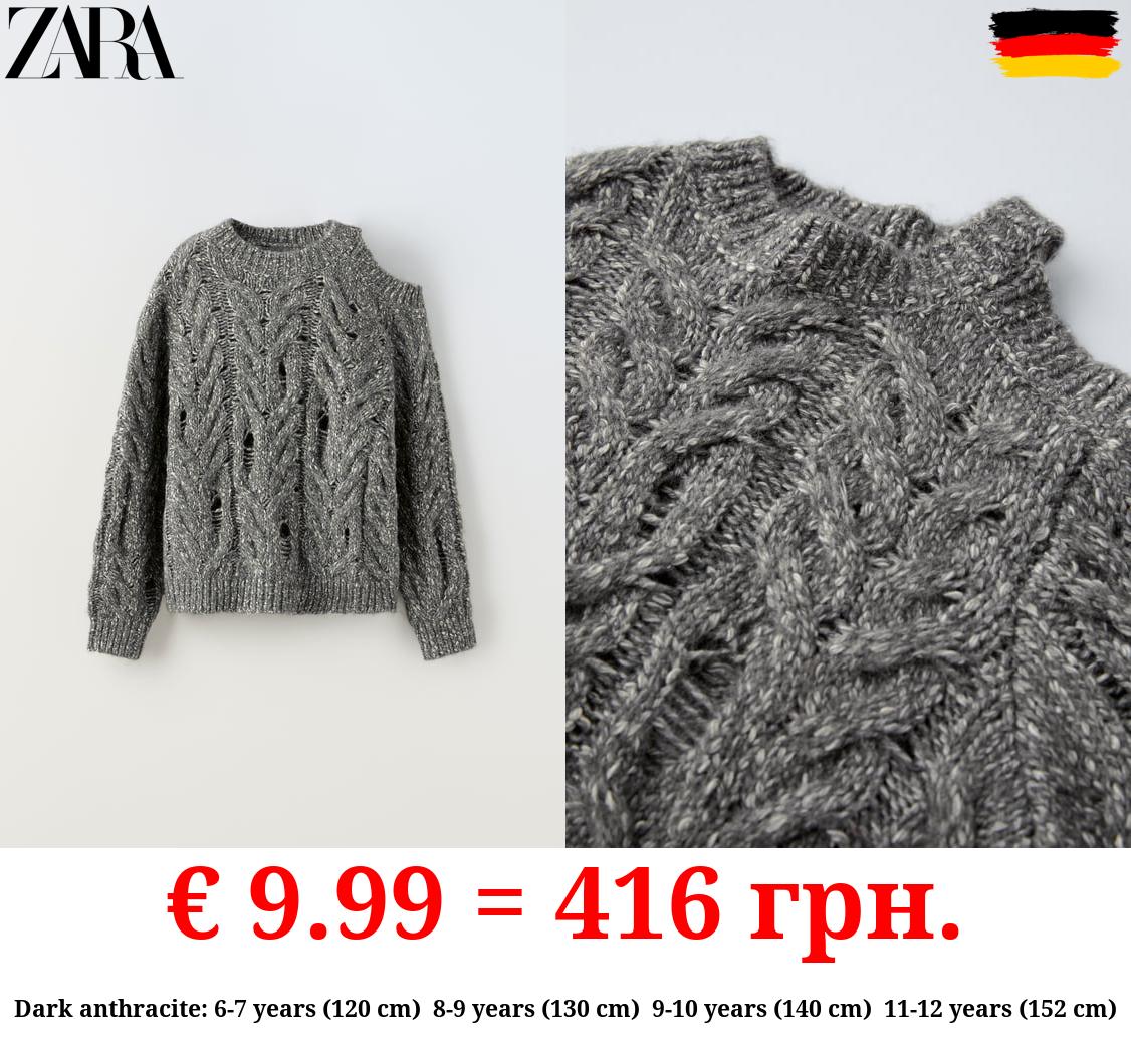 CUT-OUT CABLE-KNIT SWEATER