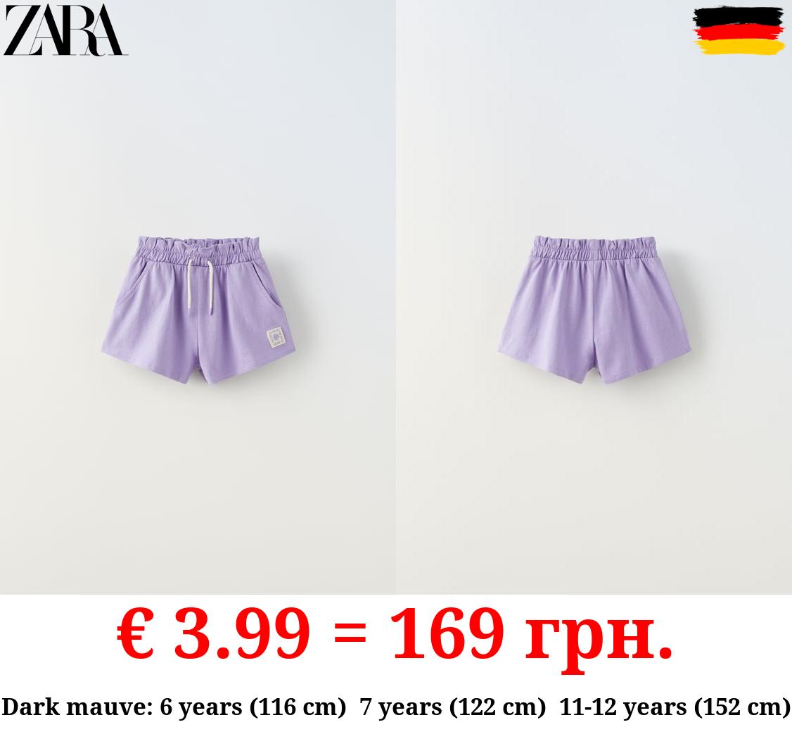 PLUSH BERMUDA SHORTS WITH LABEL DETAIL