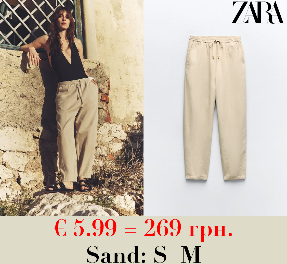 TROUSERS WITH AN ELASTICATED WAISTBAND