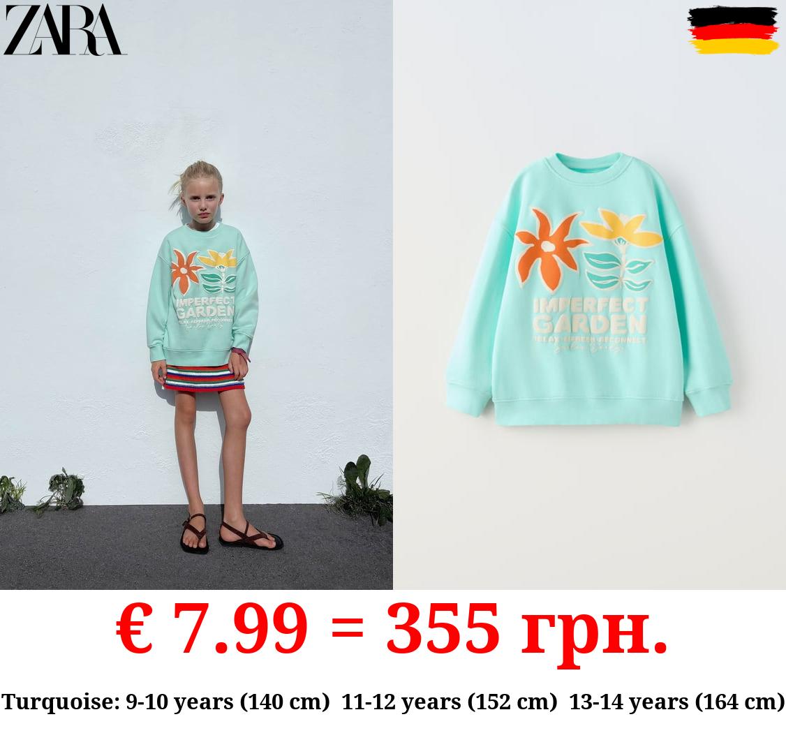 RAISED PRINT SWEATSHIRT