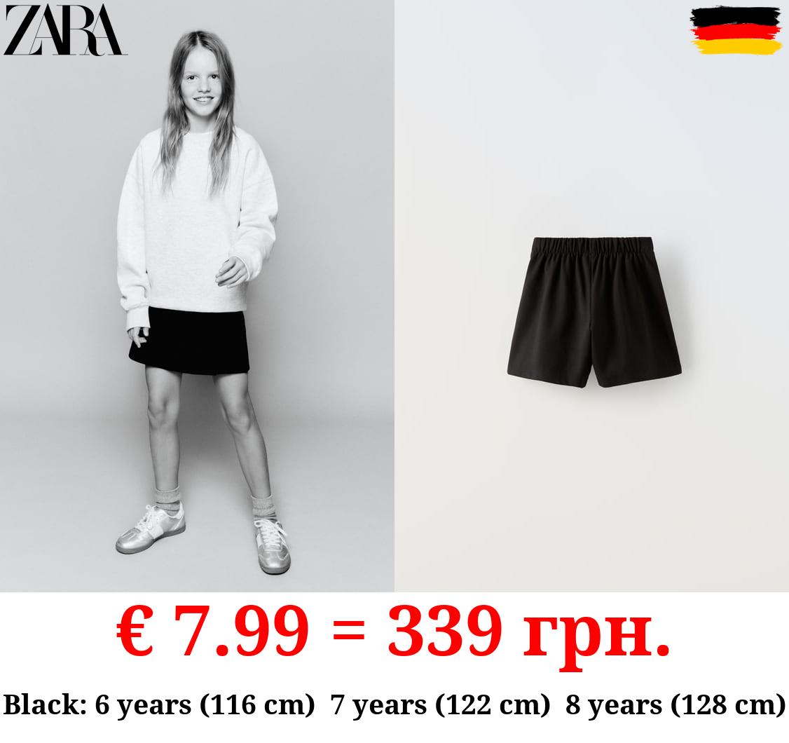 BUCKLED BERMUDA SKORT