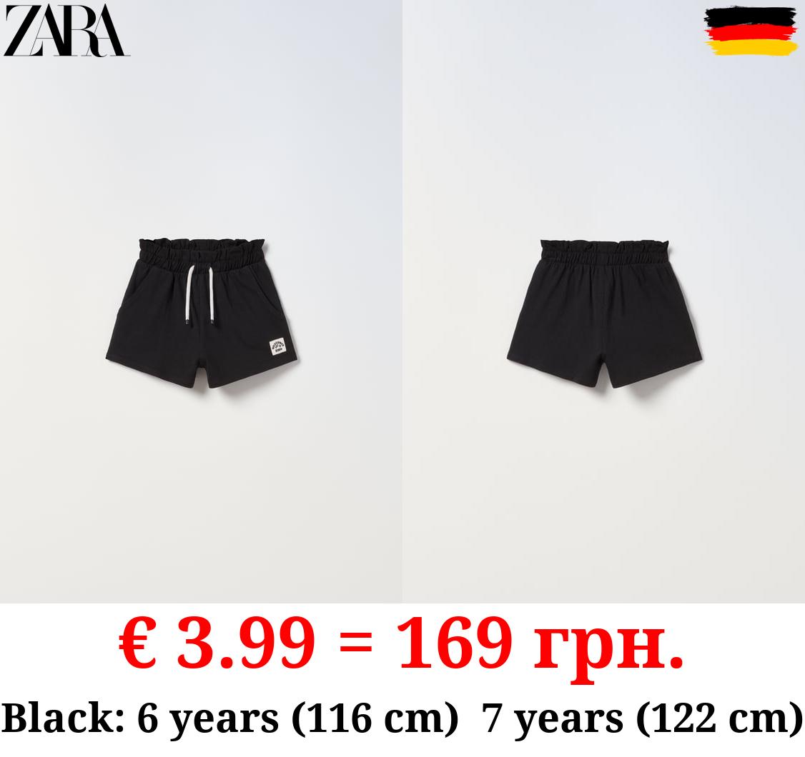 PLUSH BERMUDA SHORTS WITH LABEL DETAIL