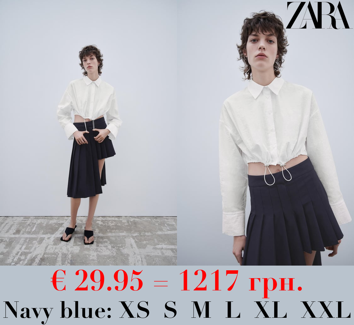 ASYMMETRIC BOX PLEAT SKIRT