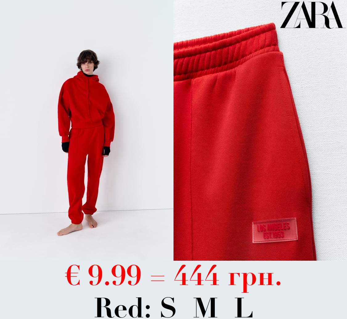 PLUSH JOGGING TROUSERS WITH SLOGAN