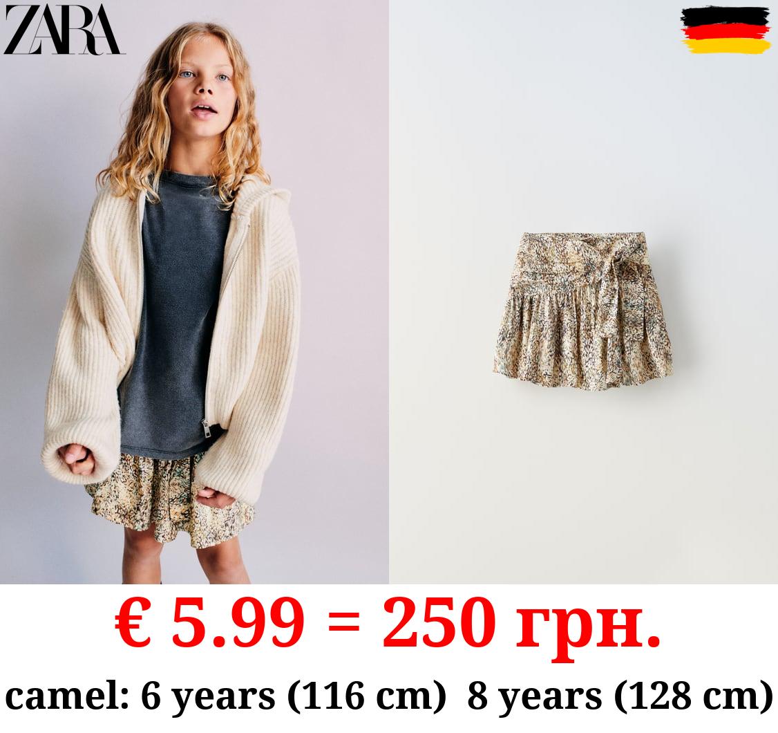 PRINTED SKIRT WITH KNOT DETAIL