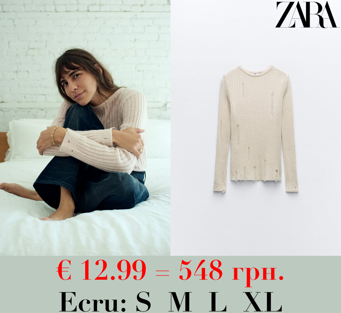 RIPPED KNIT SWEATER