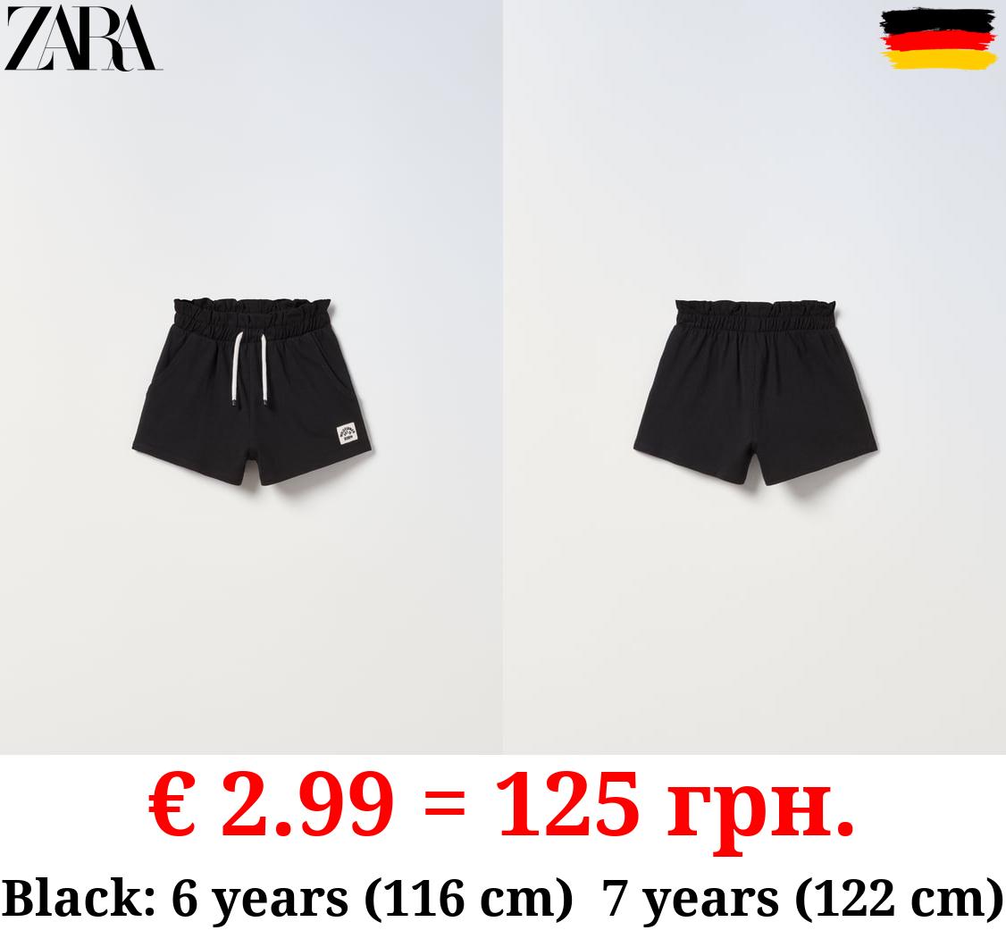 PLUSH BERMUDA SHORTS WITH LABEL DETAIL
