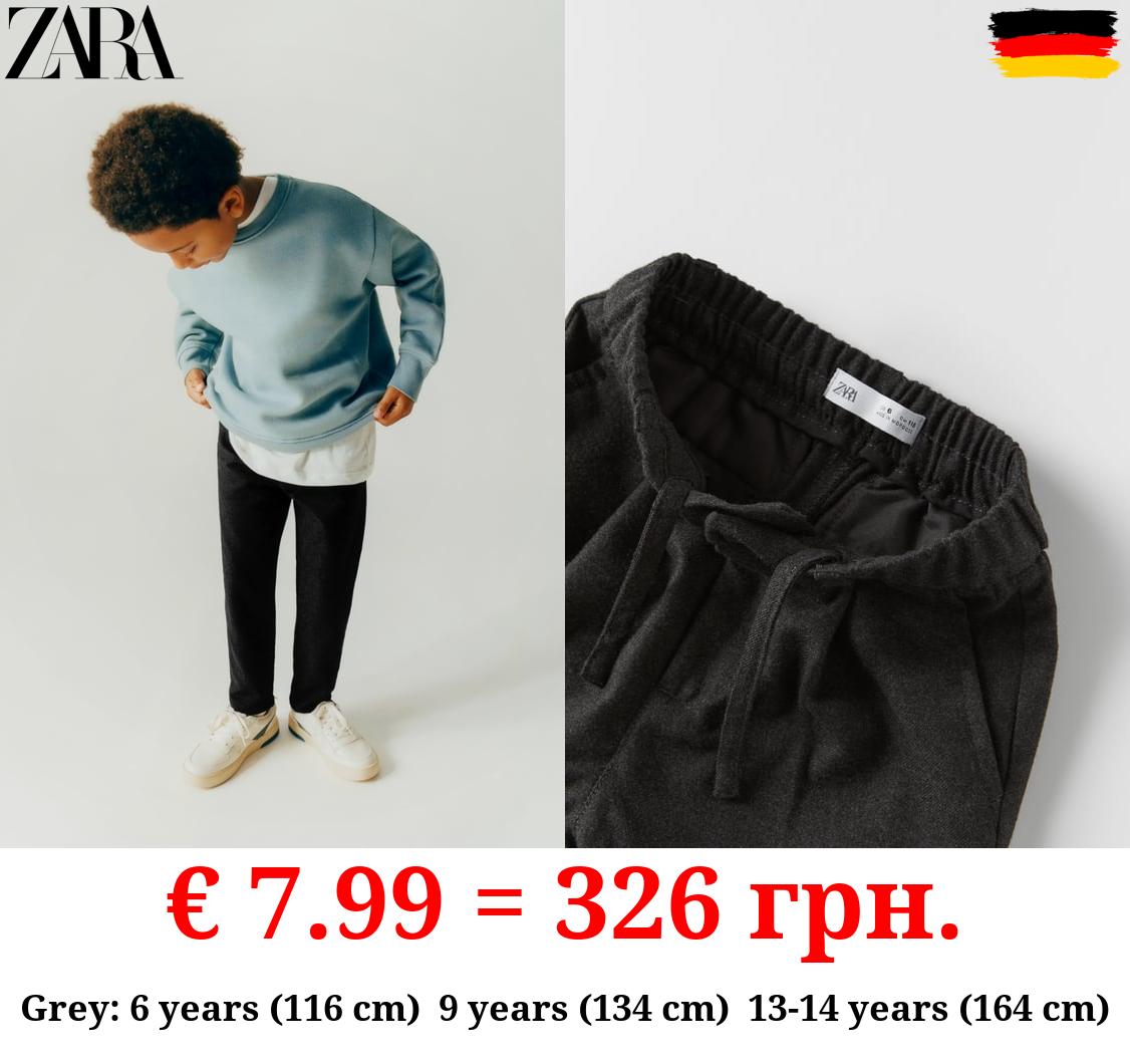 TEXTURED DARTED TROUSERS