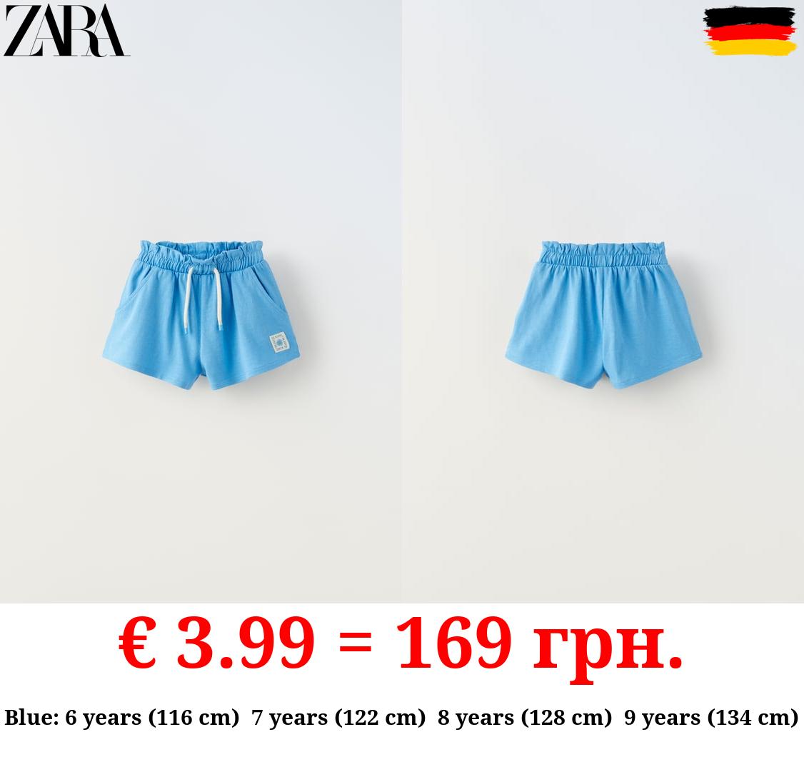 PLUSH BERMUDA SHORTS WITH LABEL DETAIL