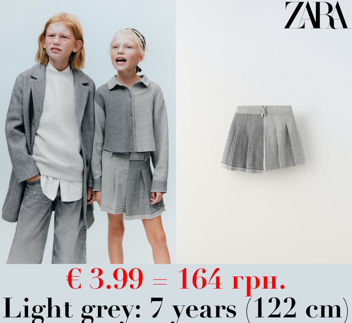 ASYMMETRIC SKIRT WITH FRAYED HEM