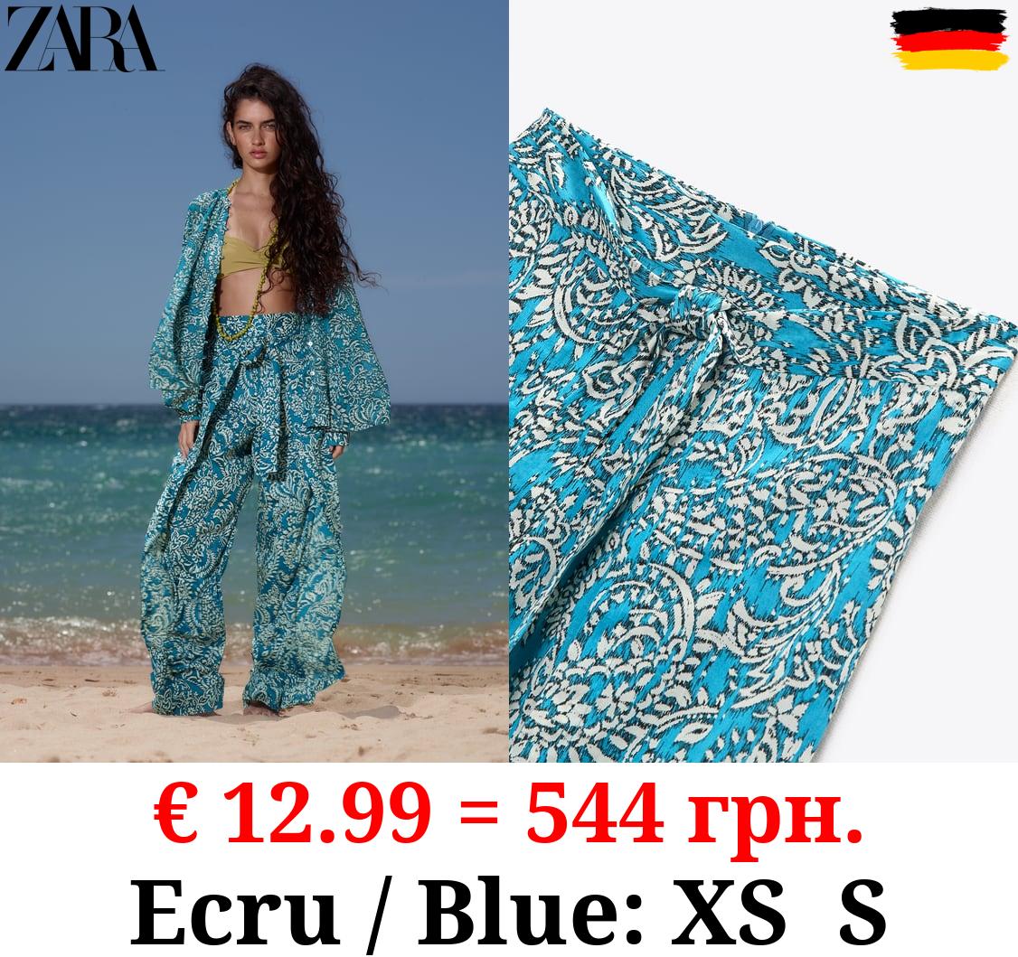 PRINTED WRAP TROUSERS