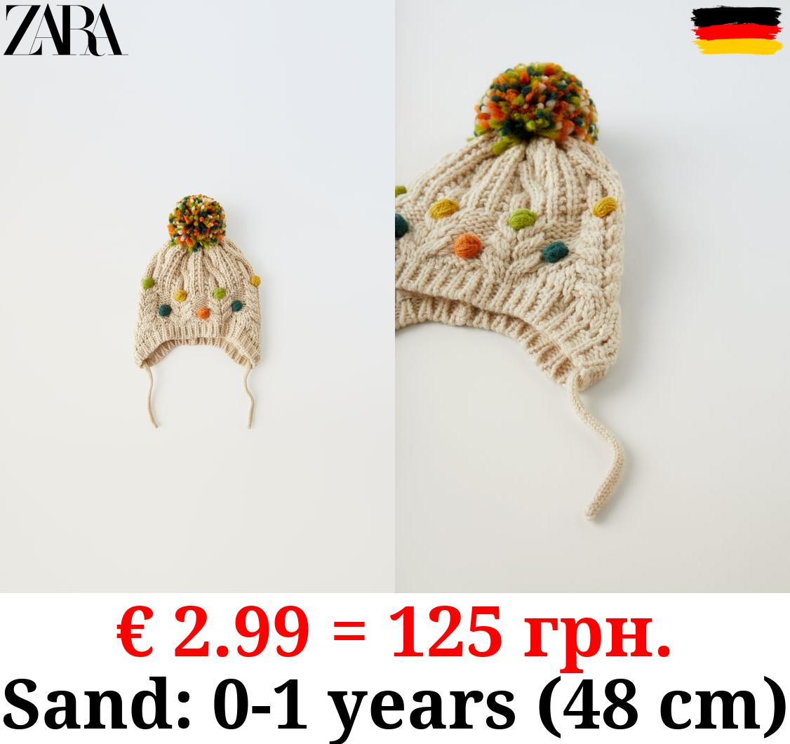 KNIT POMPOM BEANIE WITH EMBROIDERY AND EARMUFFS