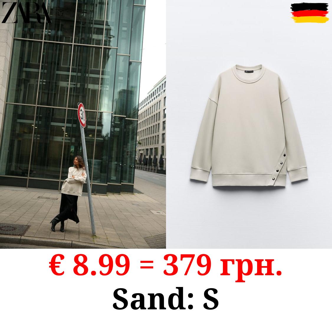 OVERSIZE SWEATSHIRT WITH SNAP BUTTONS