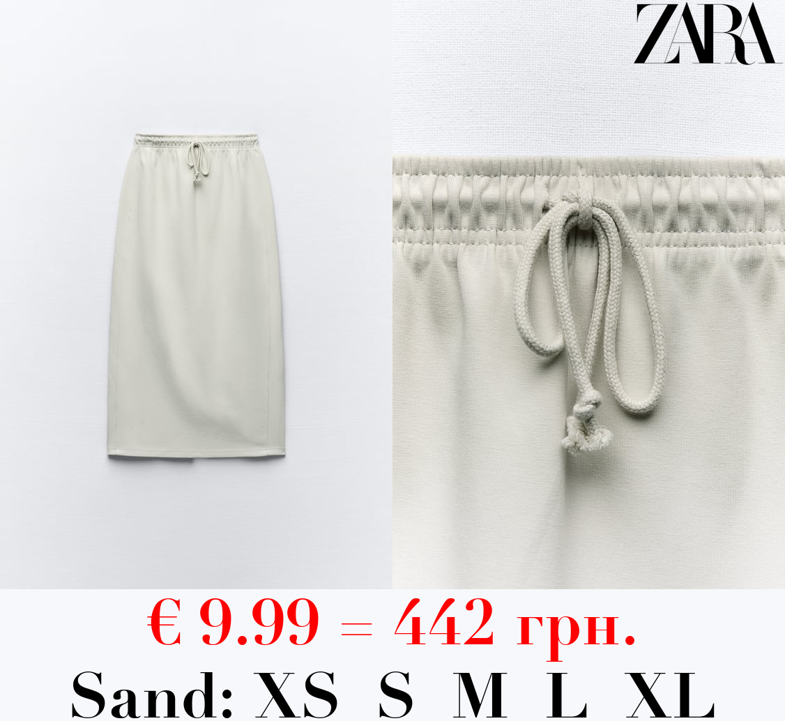 CLEAN INTERLOCK PLUSH MIDI SKIRT