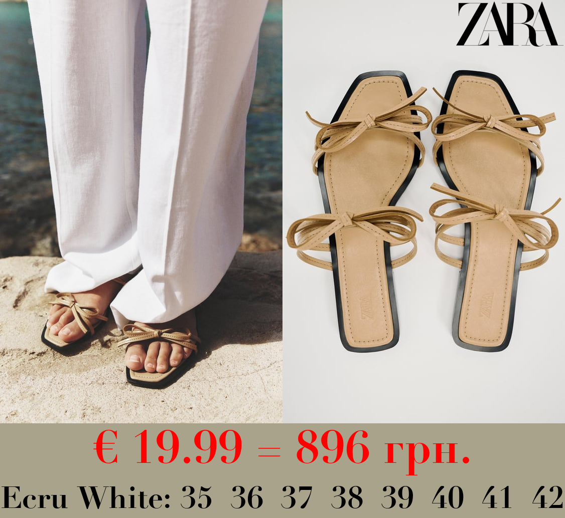 FLAT SLIDER SANDALS WITH BOWS