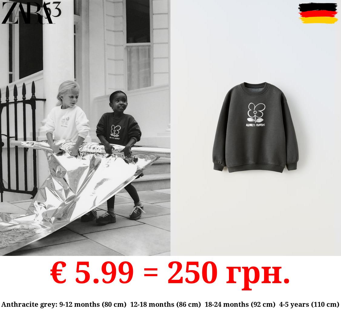 SWEATSHIRT WITH METALLIC FOIL SLOGAN