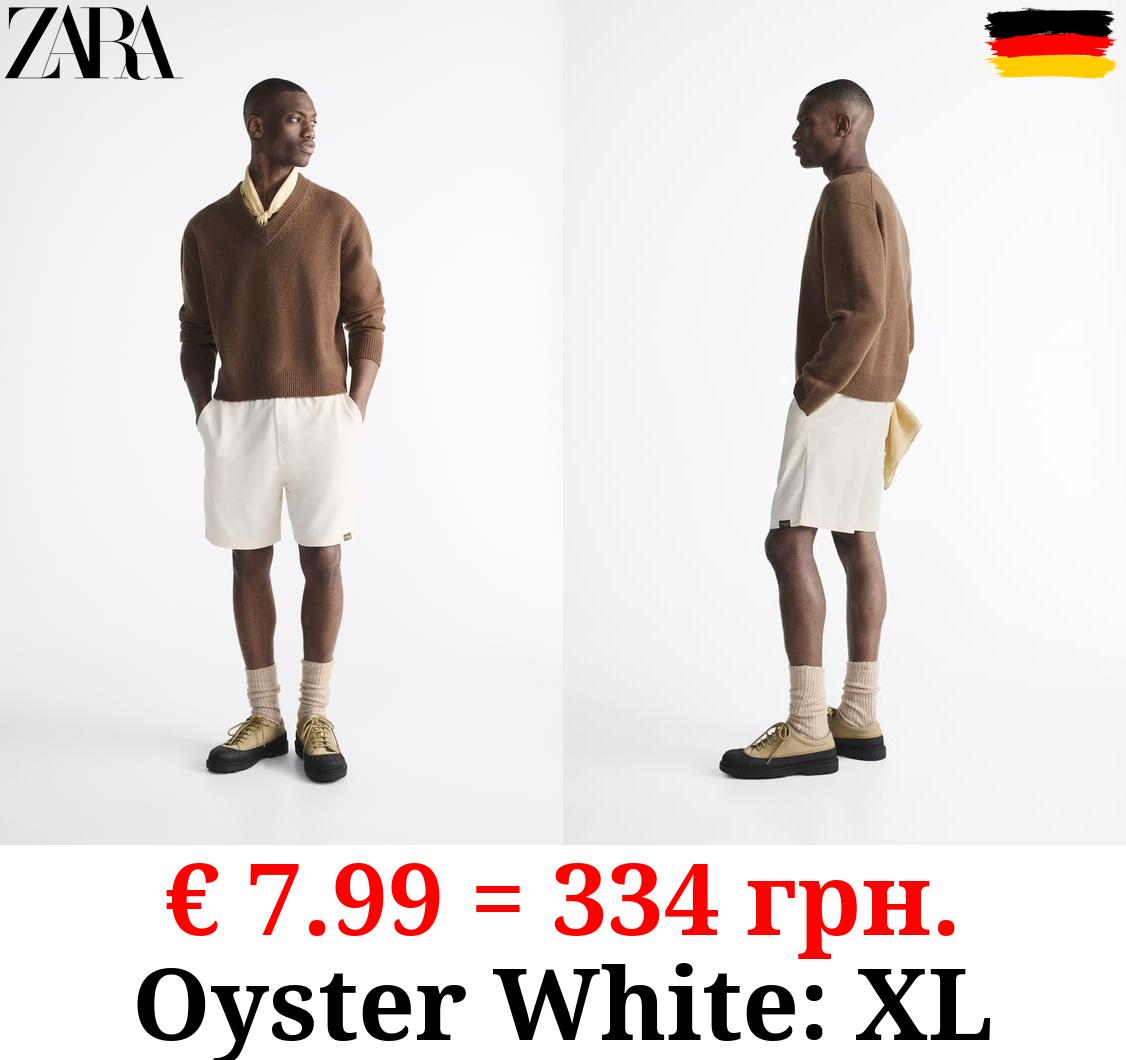 TEXTURED BERMUDA SHORTS WITH LABEL