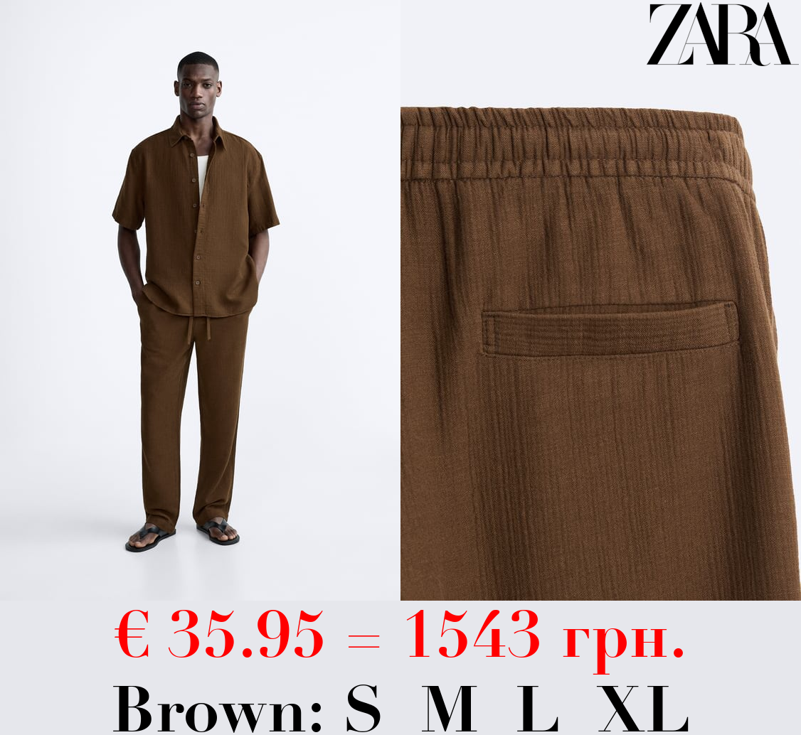 CREASED-EFFECT TROUSERS