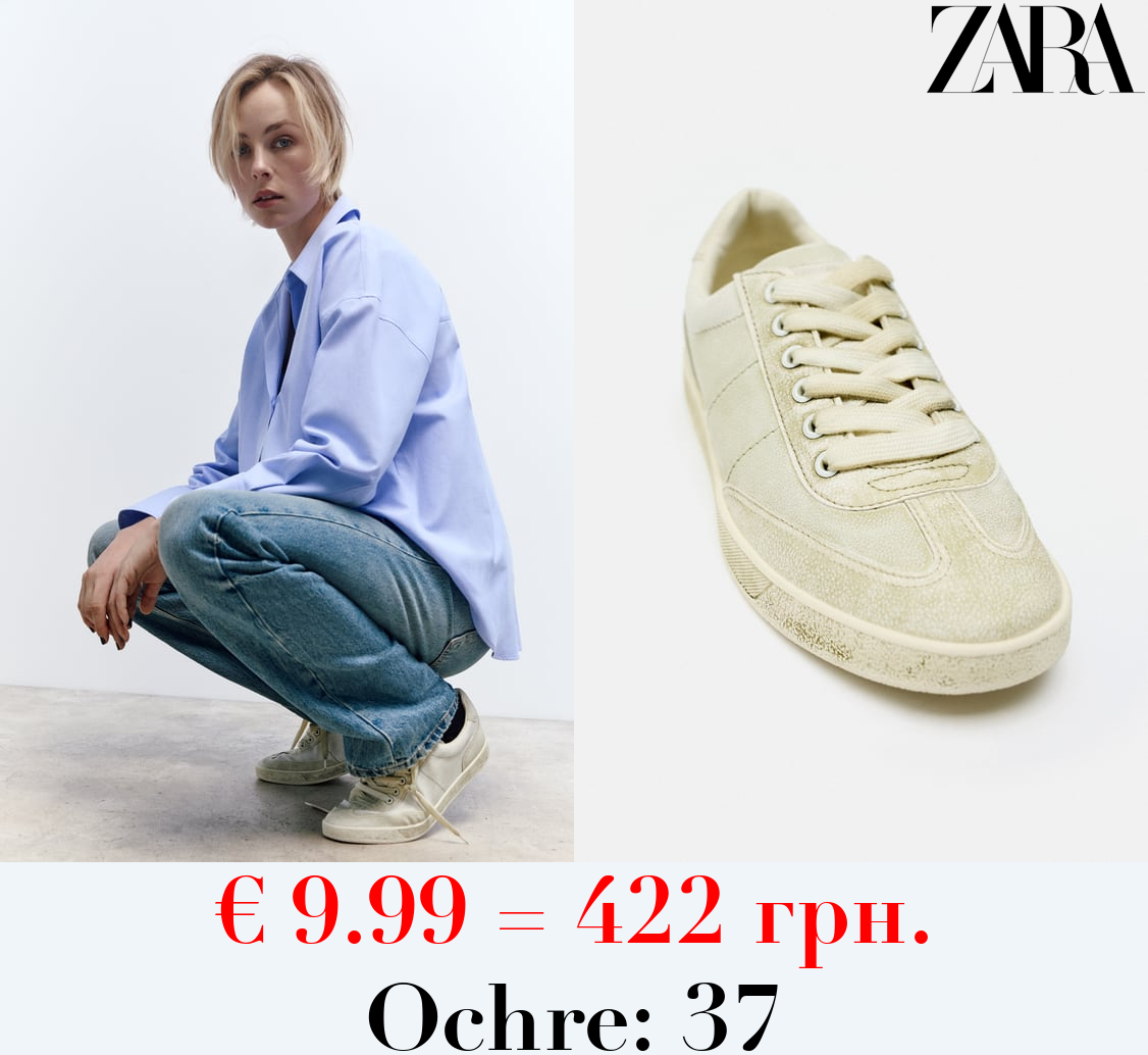 WORN-EFFECT TRAINERS