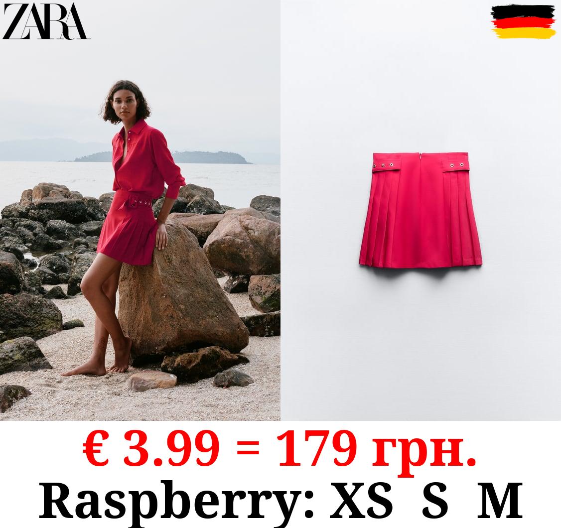 BOX PLEAT MINI SKIRT WITH BUCKLES