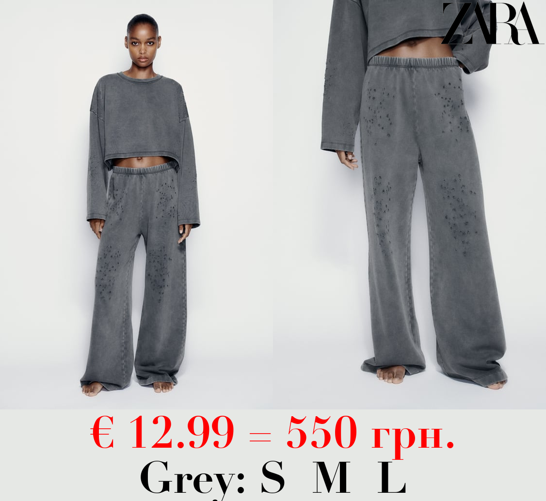 FADED-EFFECT RIPPED PLUSH TROUSERS