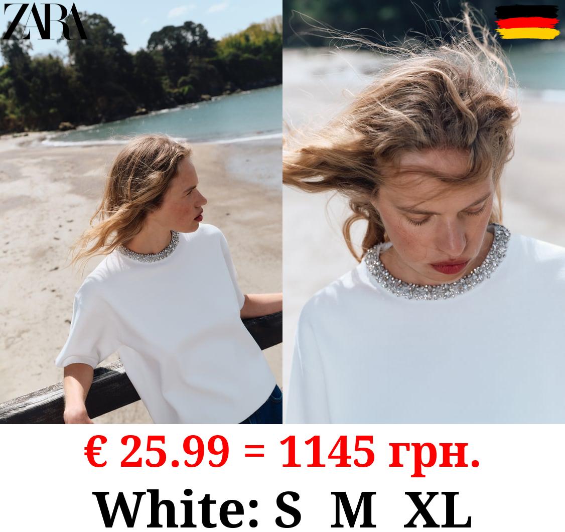 PLAIN KNIT TOP WITH RHINESTONE NECK