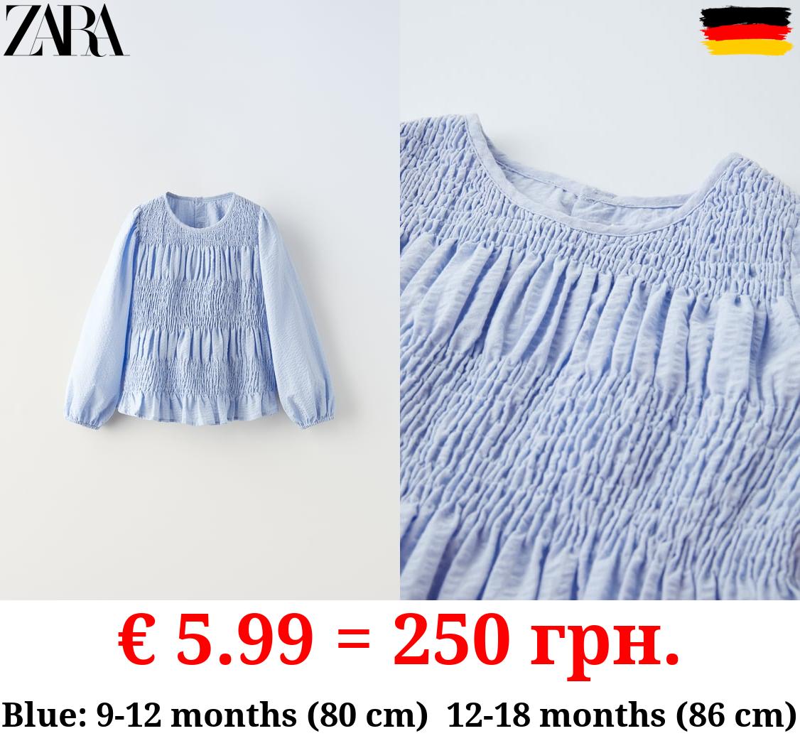 TEXTURED BLOUSE WITH ELASTICATED TRIMS