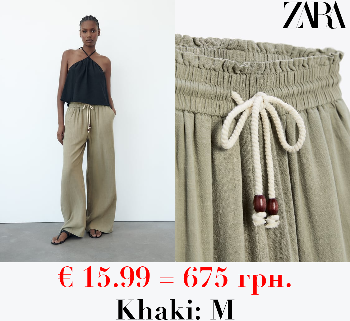 RUSTIC TROUSERS WITH ELASTICATED WAISTBAND