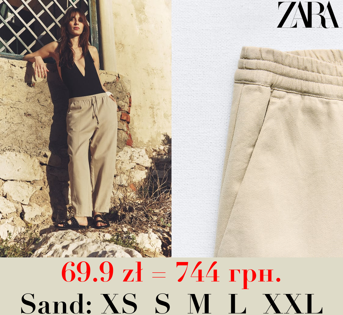 TROUSERS WITH AN ELASTICATED WAISTBAND