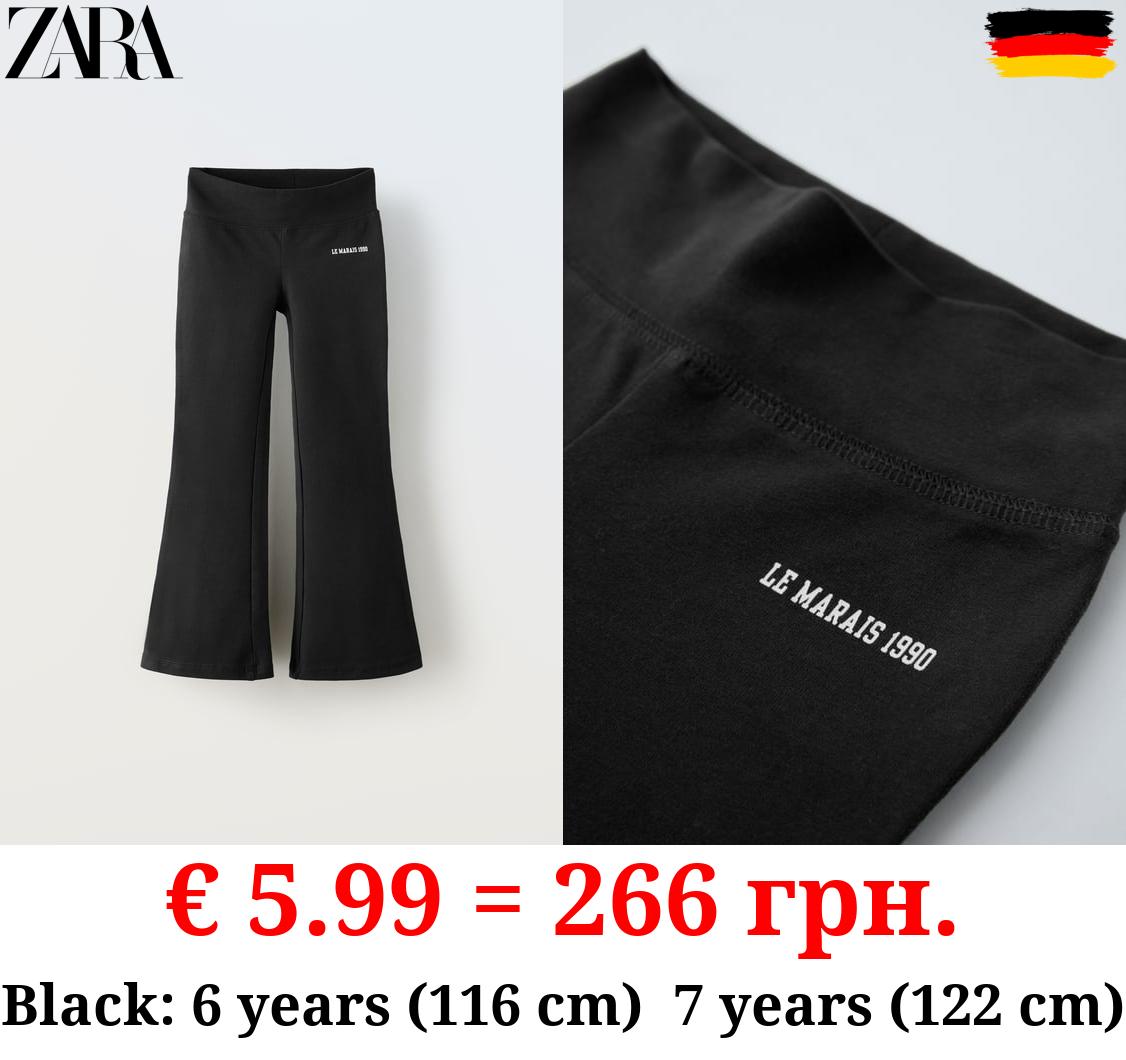 FLARED LEGGINGS WITH SLOGAN