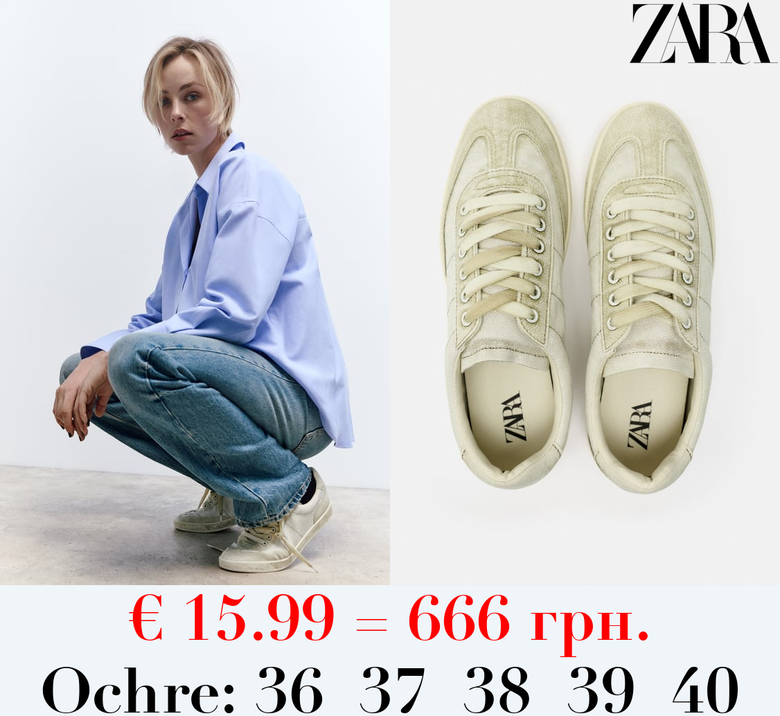 WORN-EFFECT TRAINERS