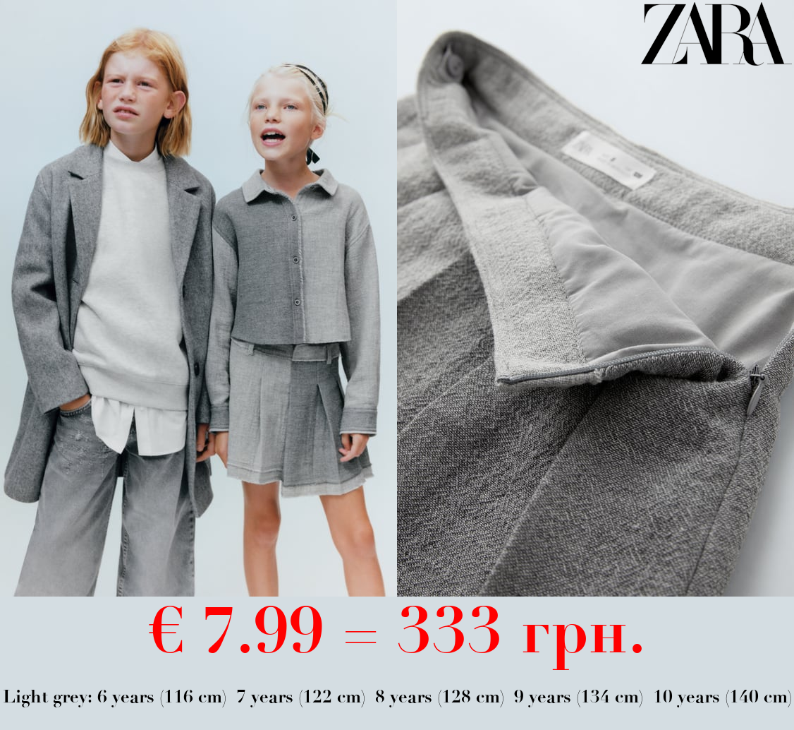 ASYMMETRIC SKIRT WITH FRAYED HEM